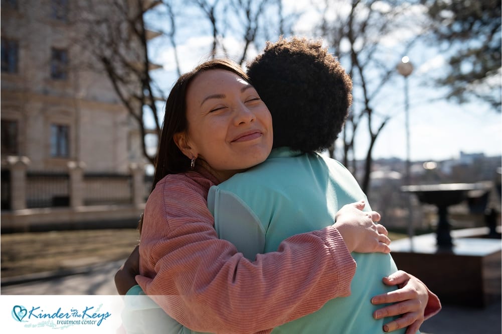 Two women hugging, offering emotional support and comfort during a difficult time.