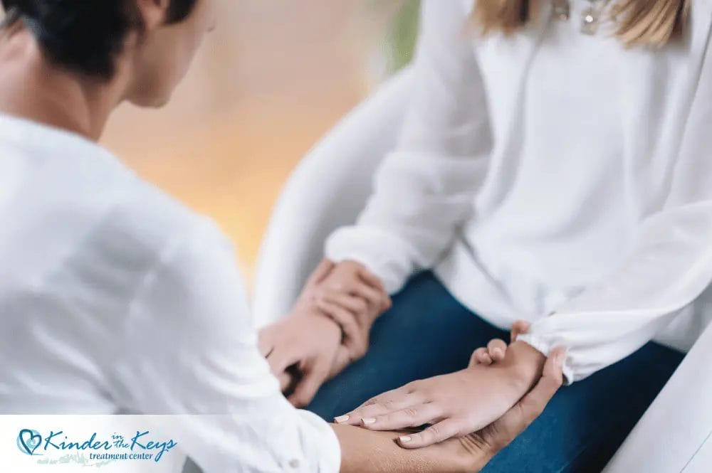 Therapist offering support to woman coping with PTSD and depression.