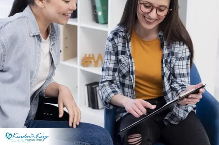 Two women reviewing notes together as part of supportive therapy for depression recovery.