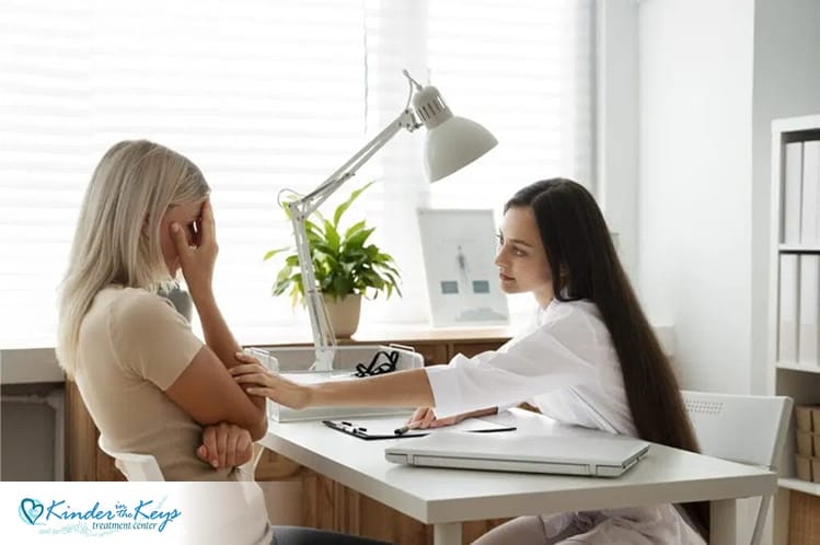 Therapist supporting woman in session, part of a holistic approach to depression.